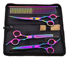 Rainbow titanium hair cutting scissor set with comb and black carrying case for barbers and stylists.